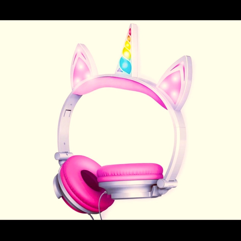 Brand NEW in box LED unicorn headphones. Two settings. Aux connection.